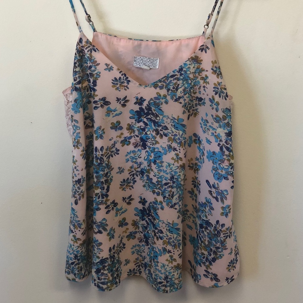 A pastel pink blouse w/ a blue floral pattern 🌷🌿